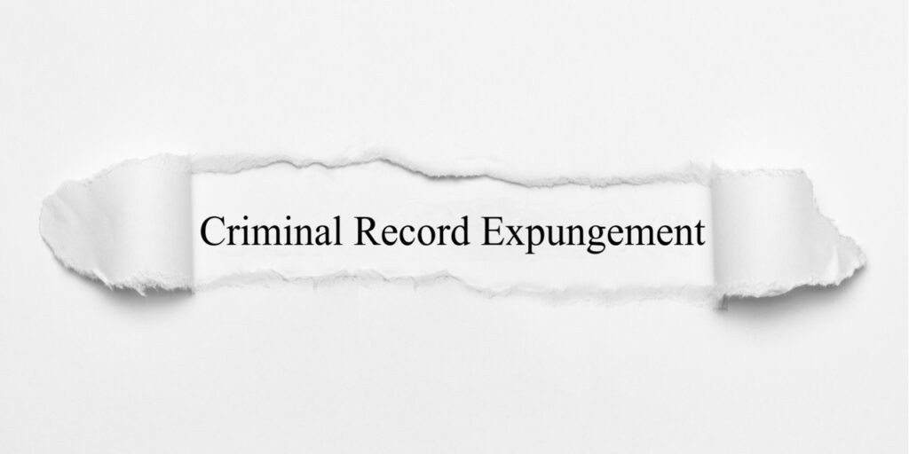 Criminal Record Expungement on white torn paper